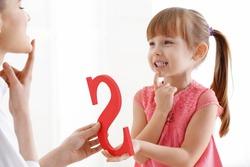 little girl at speech therapist office